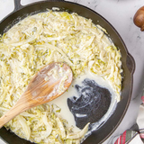 Creamed cabbage in a cast iron skillet made in the Lucky New Year cooking class at Culinary by Hobby Hill