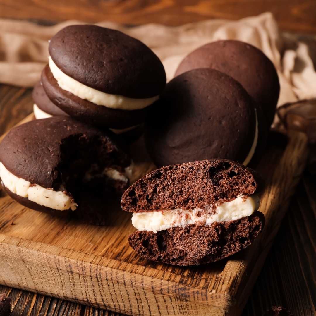 Homemade chocolate whoopie pies with marshmallow cream filling on a wooden board – Stacked Sweetness class at Culinary by Hobby Hill